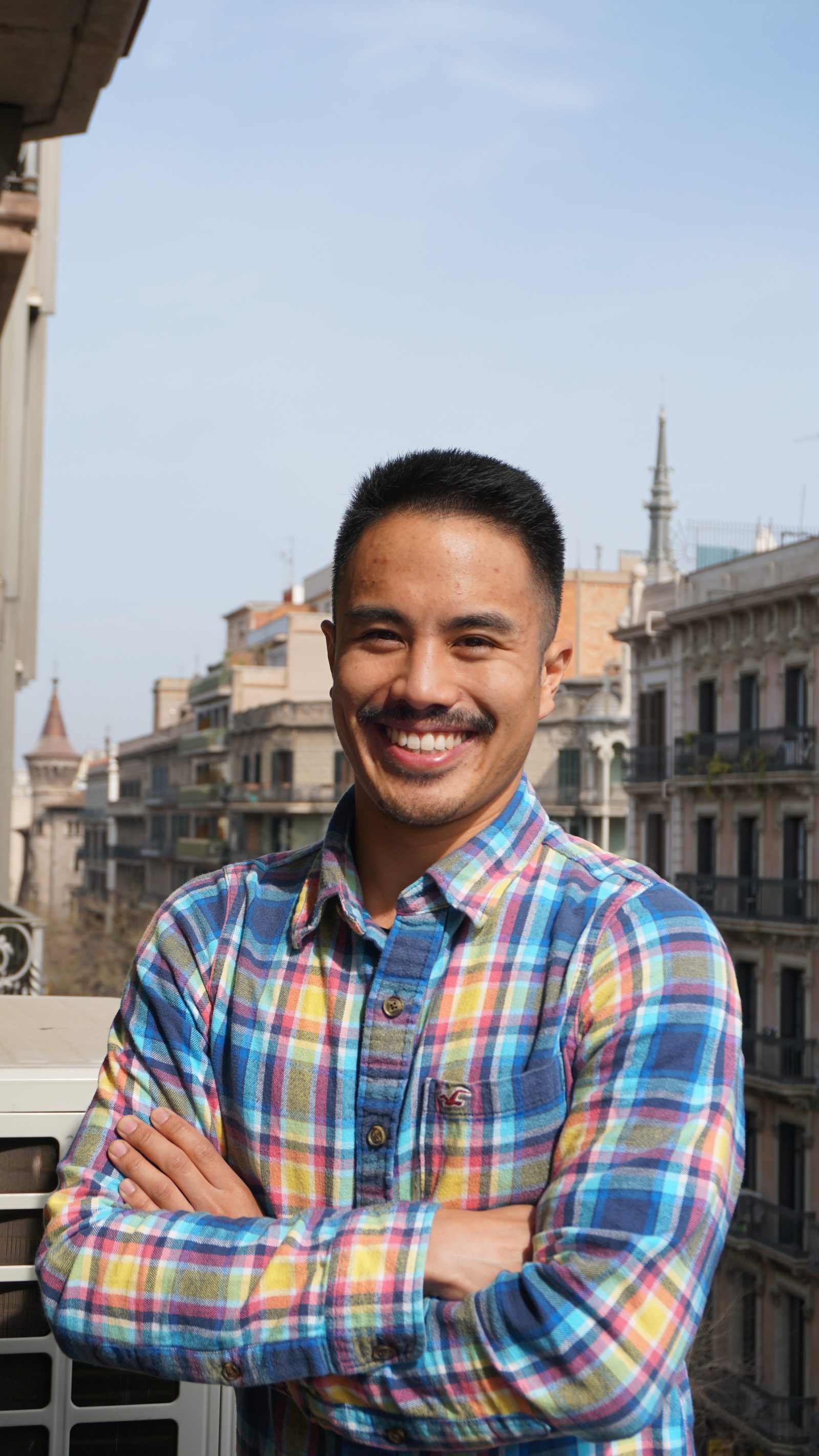 A smiling student in a Barcelona street
