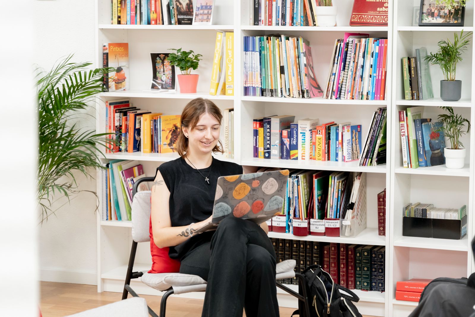 A Spanish TIE residence card, passport, and renewal documents on a desk.