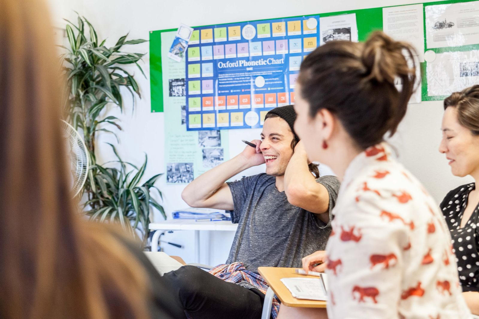 A Spanish passport stamp and student visa documents on a desk.